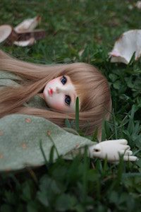 doll in grass - rain wu photographer