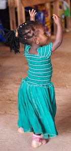 child dancing green dress by hanna morris